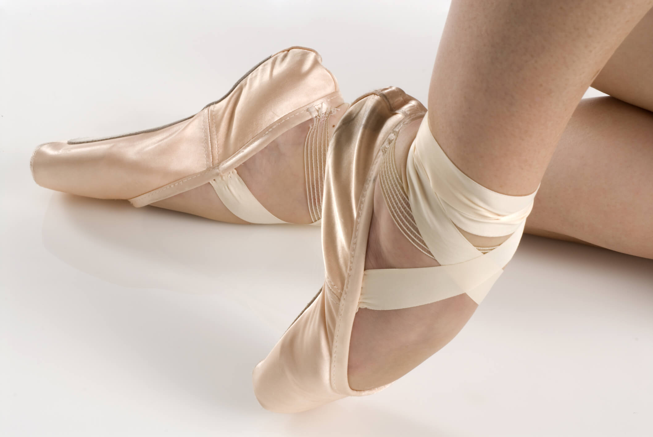 Dancer in ballet shoes dancing in pointe